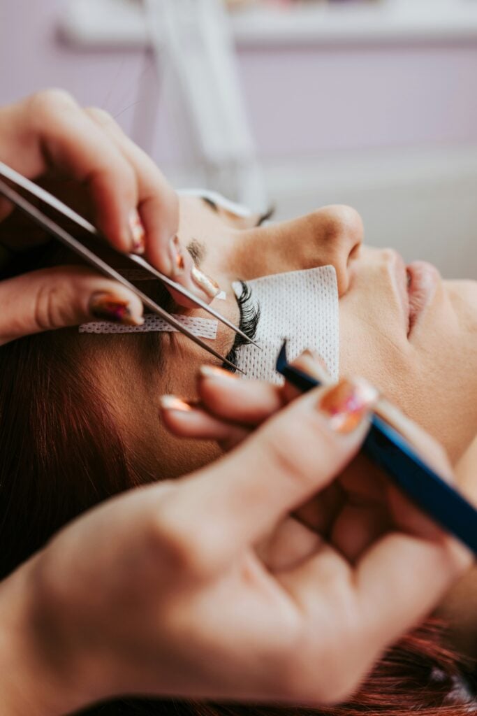 Woman receiving lash extensions